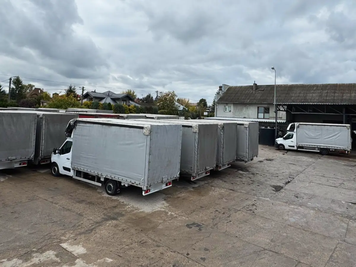 Curtainsider vans ready to leave.