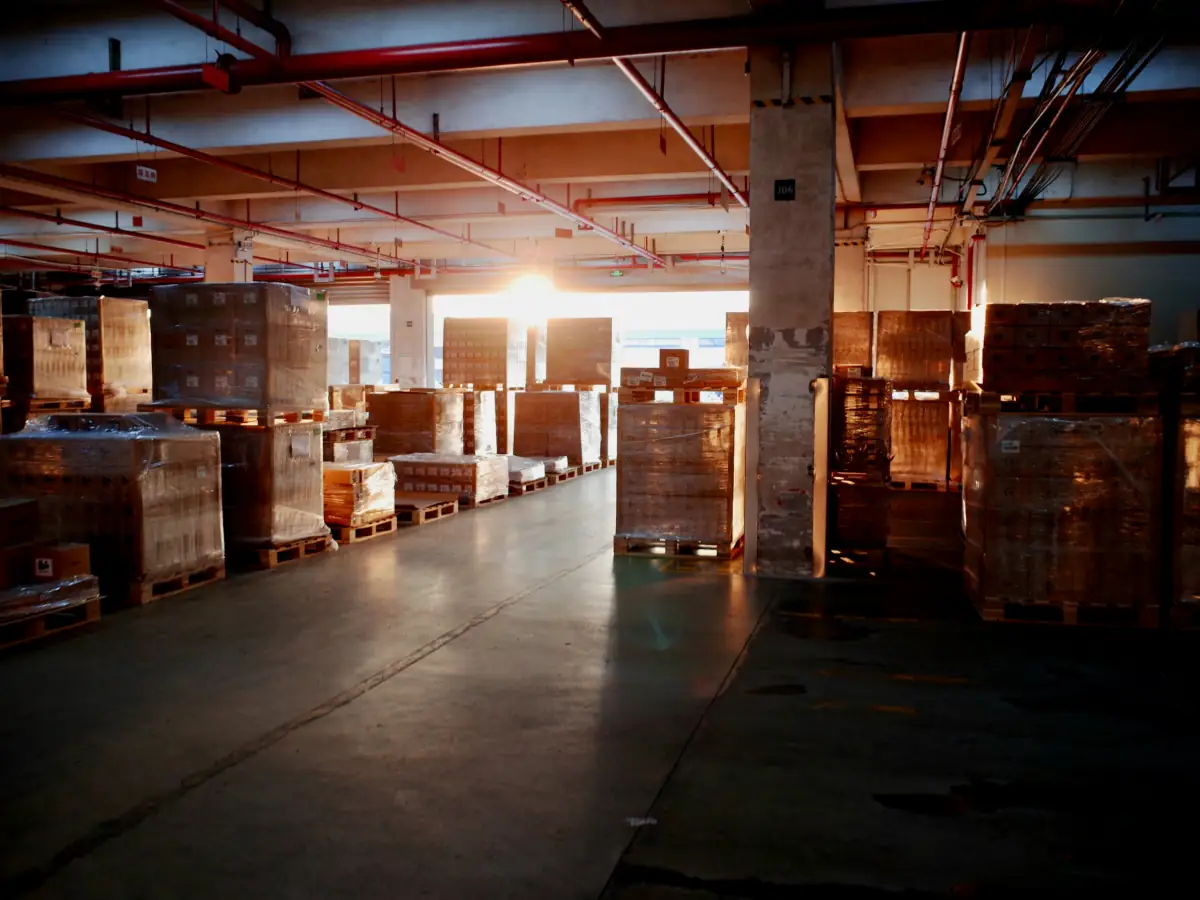Stretch-wrapped pallets in a warehouse.