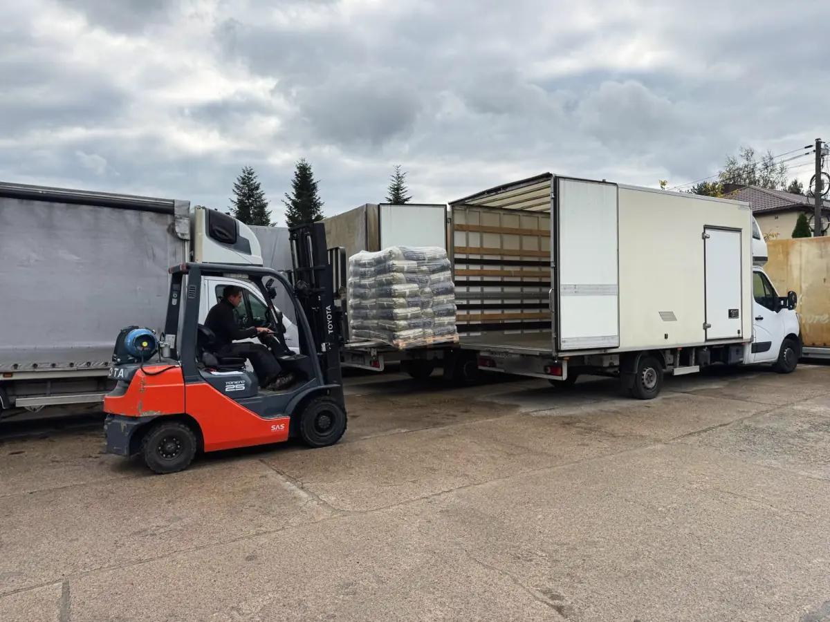 Loading a pallet into a van at our base.